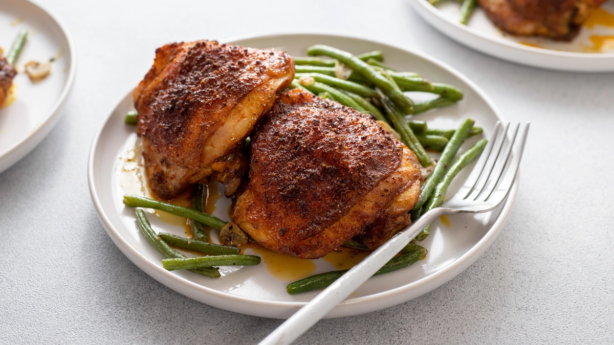 Tender chicken thighs with a crispy curry rub for a flavorful bite.