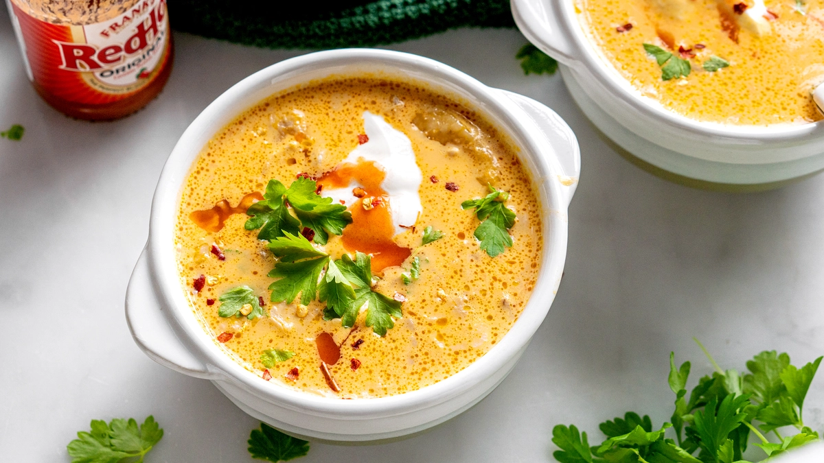 Creamy buffalo chicken soup, slow-cooked for a spicy, comforting dish.