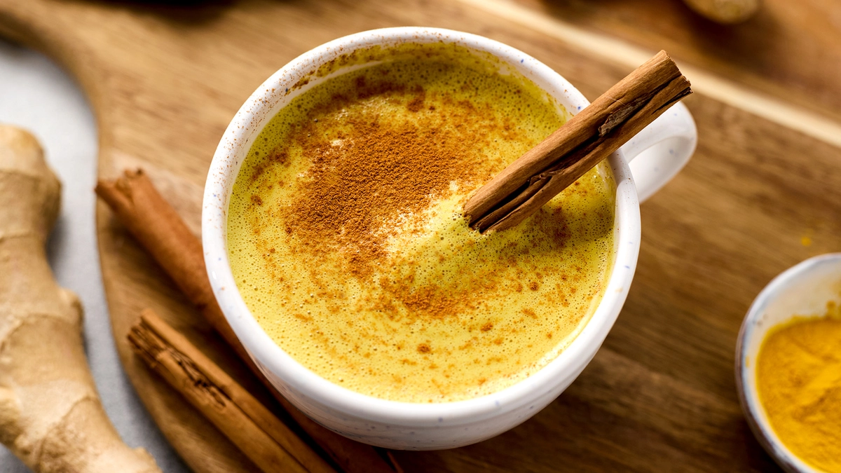 A creamy, spiced turmeric latte in shake form, perfect for keto diets.